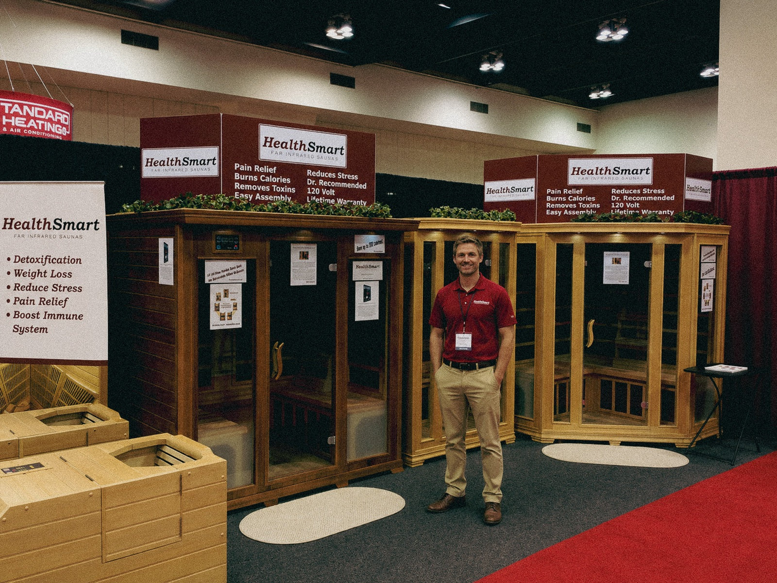 HealthSmart founder standing at the company booth at a home show in 2011